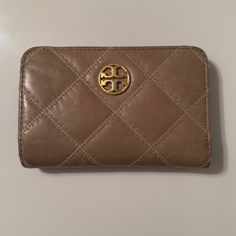 Tory Burch Tan Quilted Wallet with Gold Emblem.